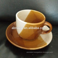 stoneware color glazed cup and saucer